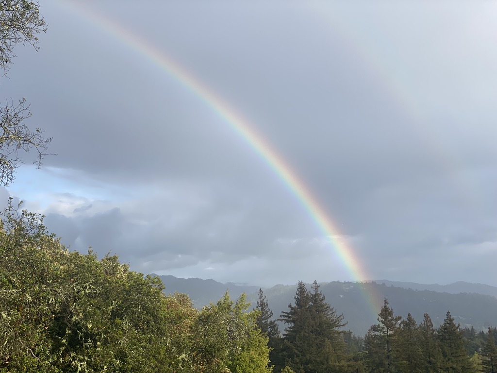 A double rainbow over the Santa Cruz Mountains at Living Well Event Center
