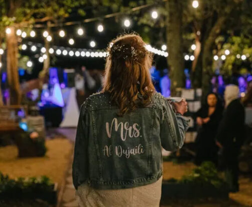 Evening celebration with string lights at Living Well Event Center